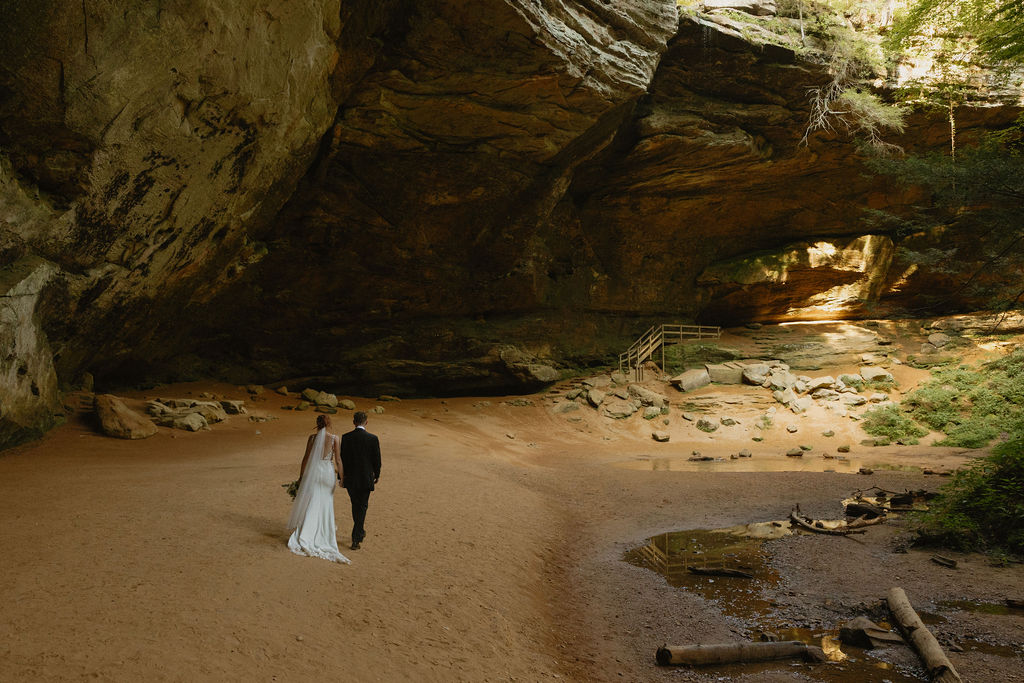 Couple walking along Ash Cave after eloping in Hocking Hills