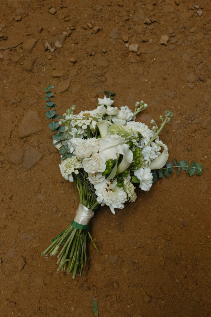 A brides bouquet laying on the ground at Hocking Hills