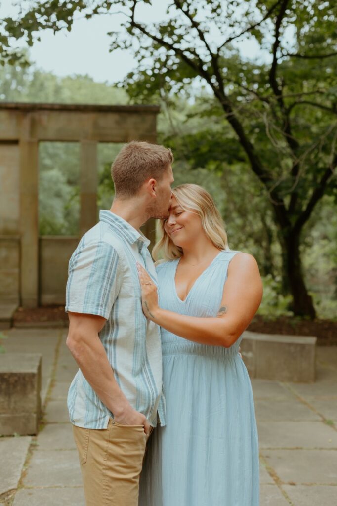 boy kissing girls forehead during their Cleveland engagement session