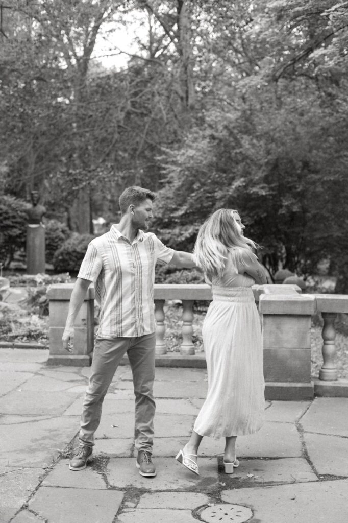 boy twirling girl during their Cleveland engagement session