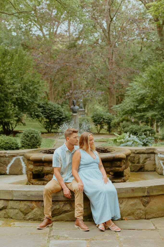 couple sitting on pond at the cultural gardens in Cleveland