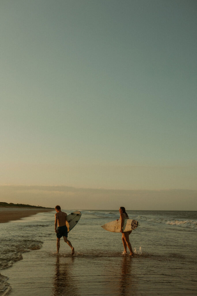 man and woman walking to shore on St Augustine beach