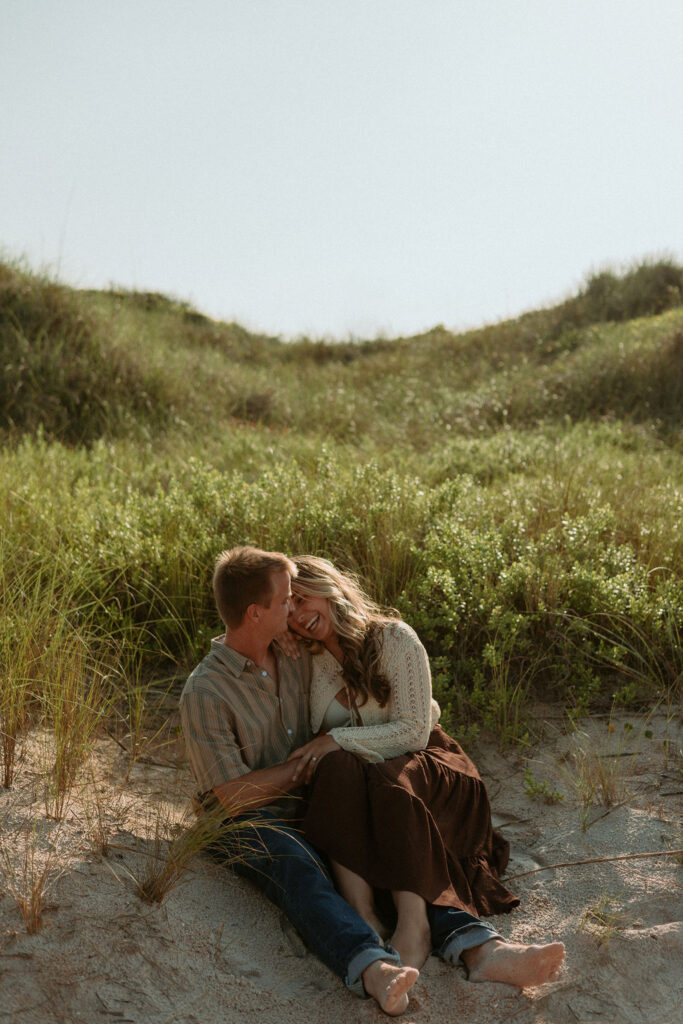 woman and man sitting together on the St Augustine dunes