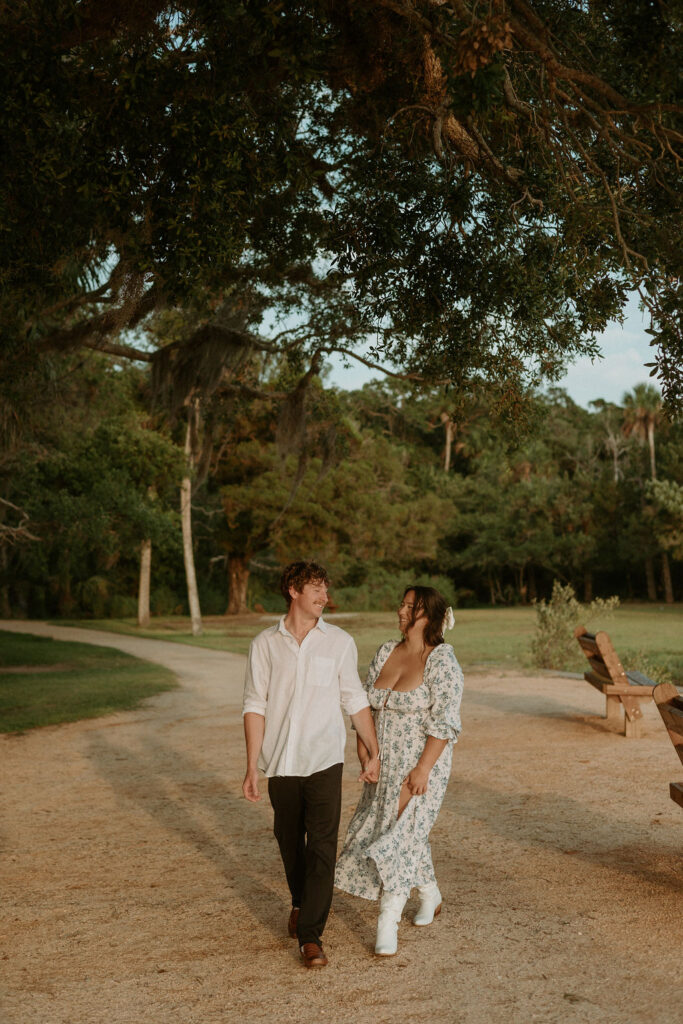 man and woman walking side by side along the Washington Oaks Gardens beach 