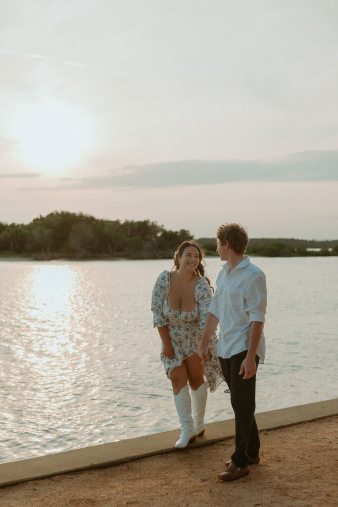 woman walking along the washington oaks gardens beach with a man