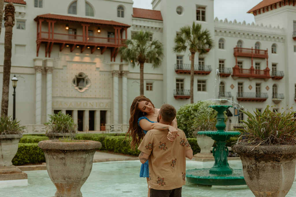 woman wrapping her arms around a mans shoulders during their downtown St Augustine photos 