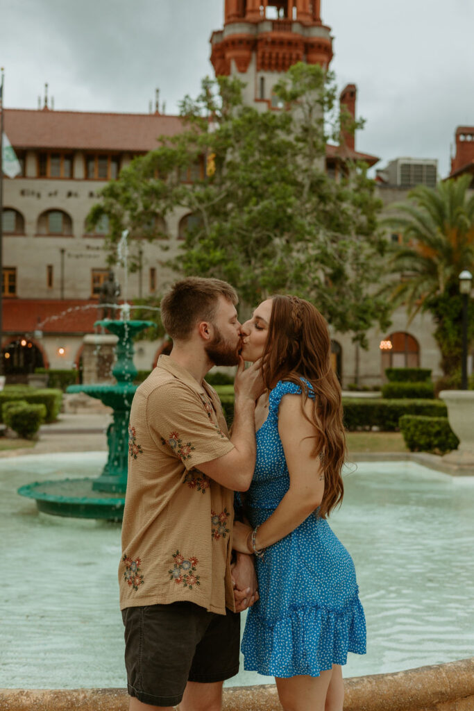 couple kissing near downtown St Augustine fountain