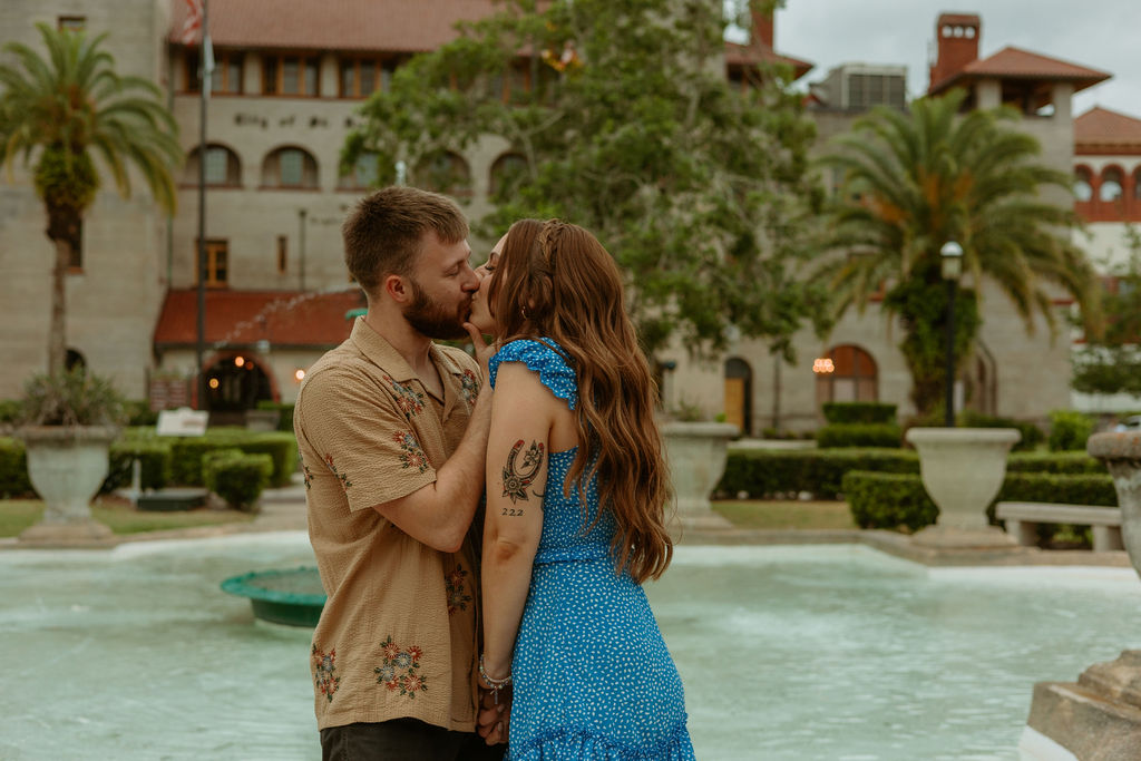 downtown St Augustine couple kissing by a fountain