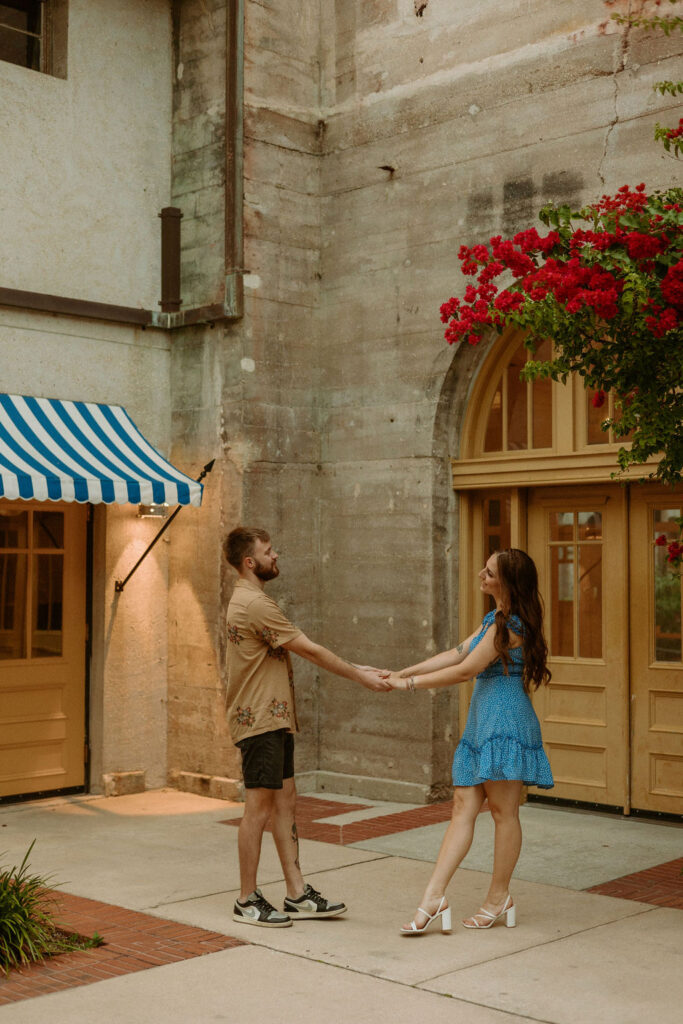 man and woman holding hands in downtown St Augustine