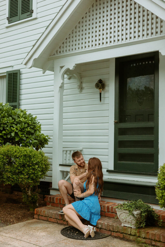 woman sitting with a man on a front porch in St Augustine