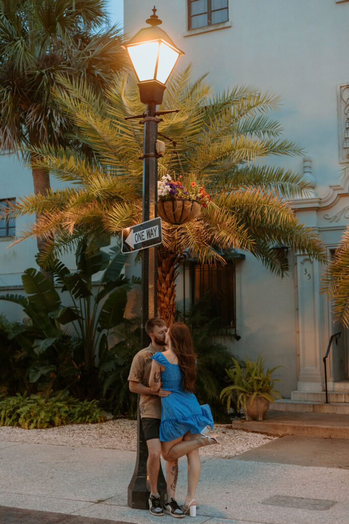 woman kissing man under a St Augustine street lamp