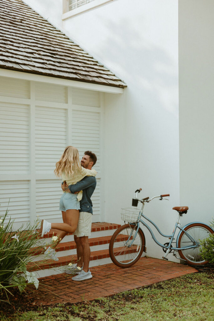 man lifting up woman