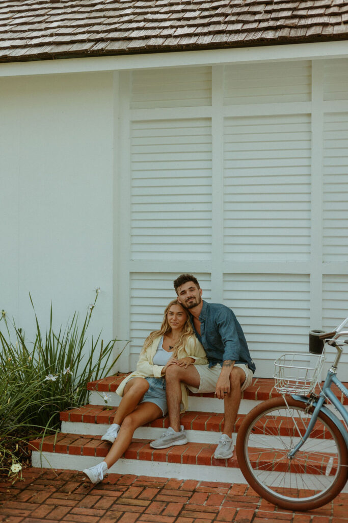 couple sitting down on the stairs in St Augustine