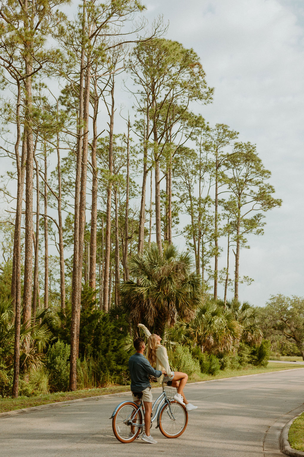 couple riding a bike in a St. Augustine neighborhood