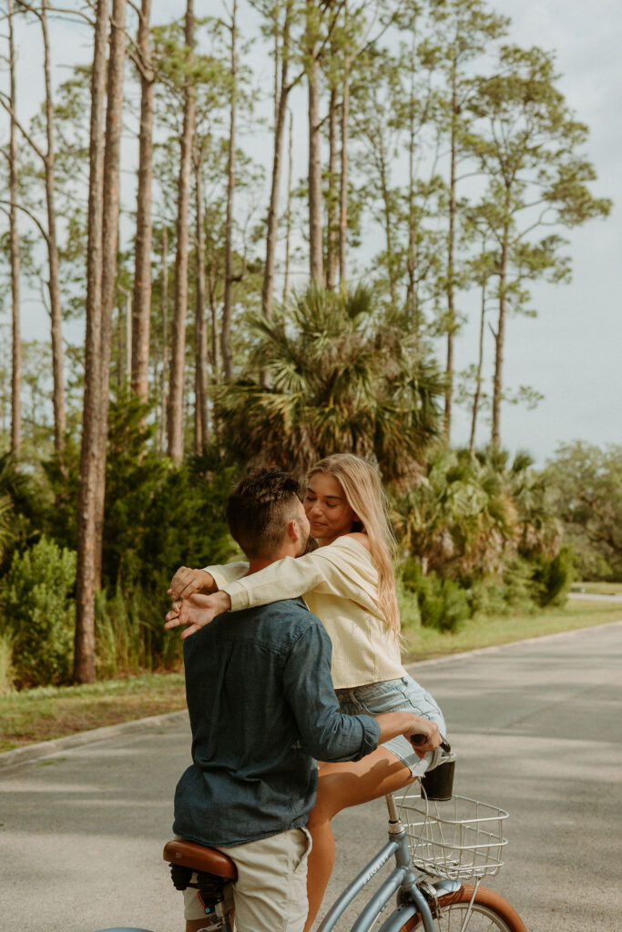 couple embracing on a bike in St Augustine 