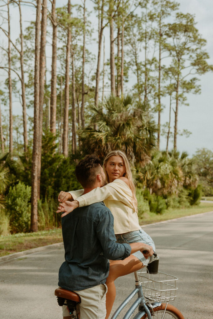 St Augustine bike photos of a woman wrapping her arms around a man