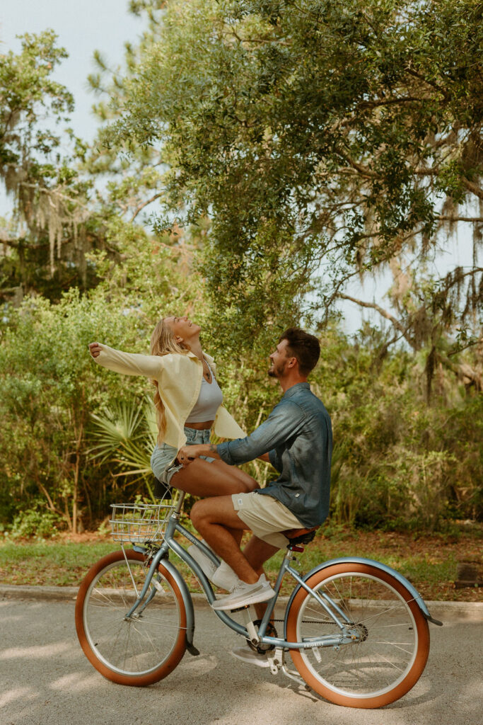 couple biking together for their St Augustine photos 