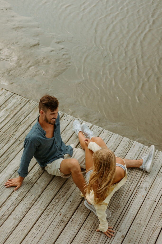 man and woman sitting on St Augustine dock