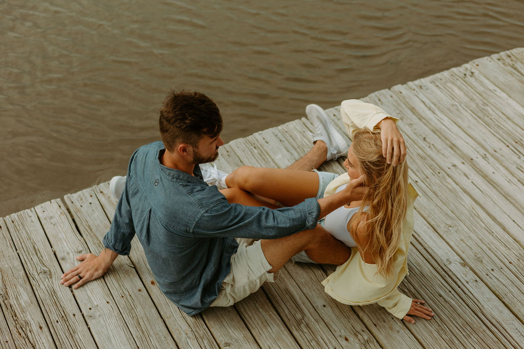 couple sitting down on the dock