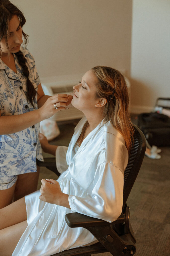 a bride getting her makeup done