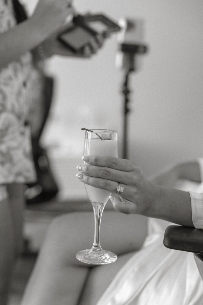 closeup of a girl's hand holding a mimosa 