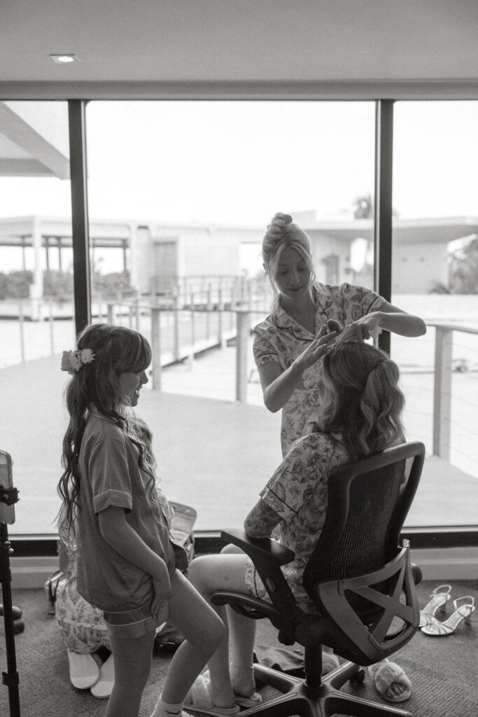 bridesmaids doing each others hair for a puerto rico wedding