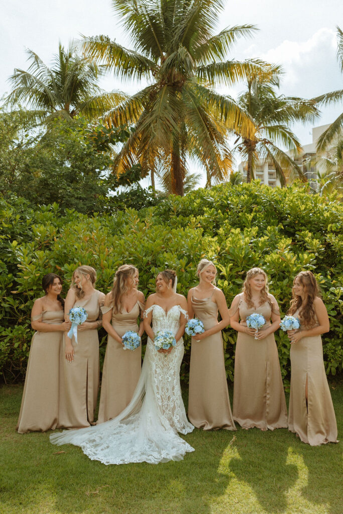 photo of bridesmaids standing next to a bride 