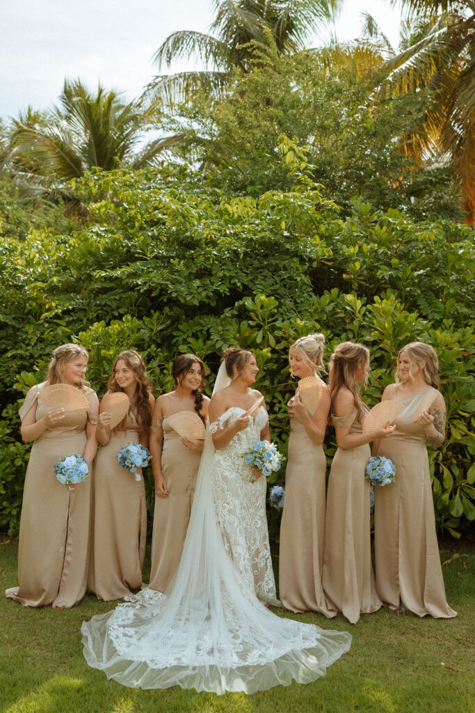 bridesmaids and bide fanning themselves in the puerto rico heat 