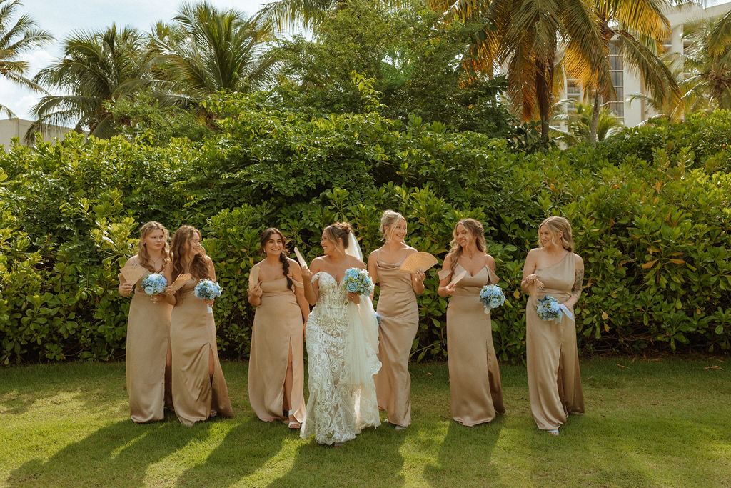 bride and bridesmaids walking outside of puerto rico wedding venue 