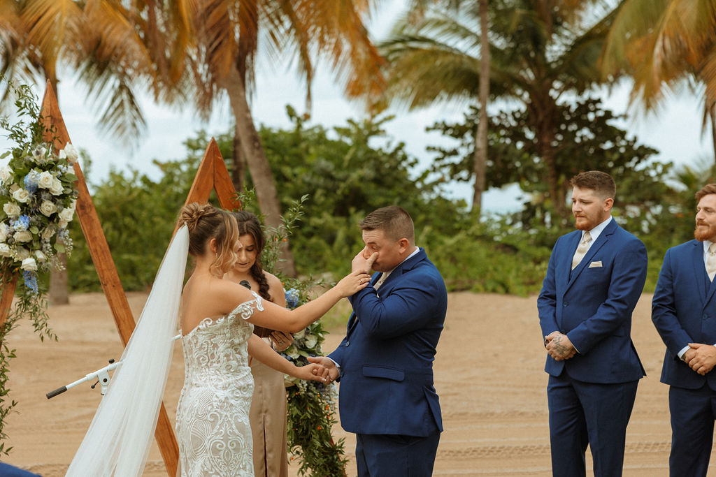 groom crying during his wedding ceremony