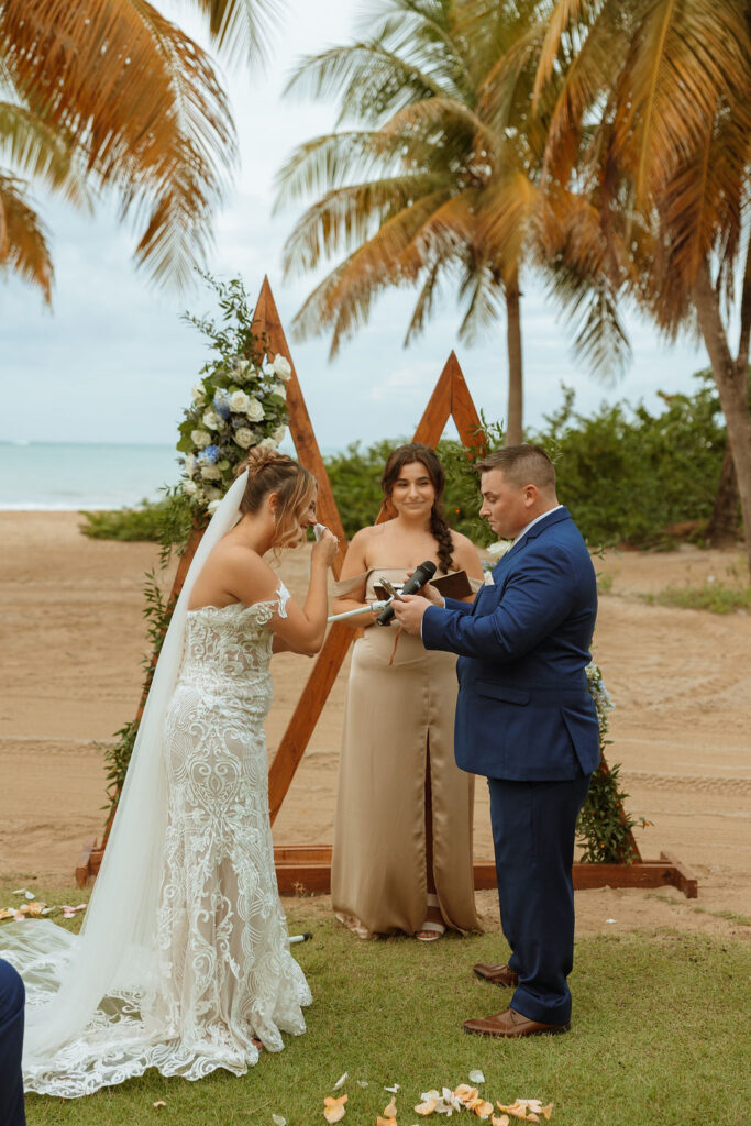 bride laughing during grooms vows at their puerto rico wedding 