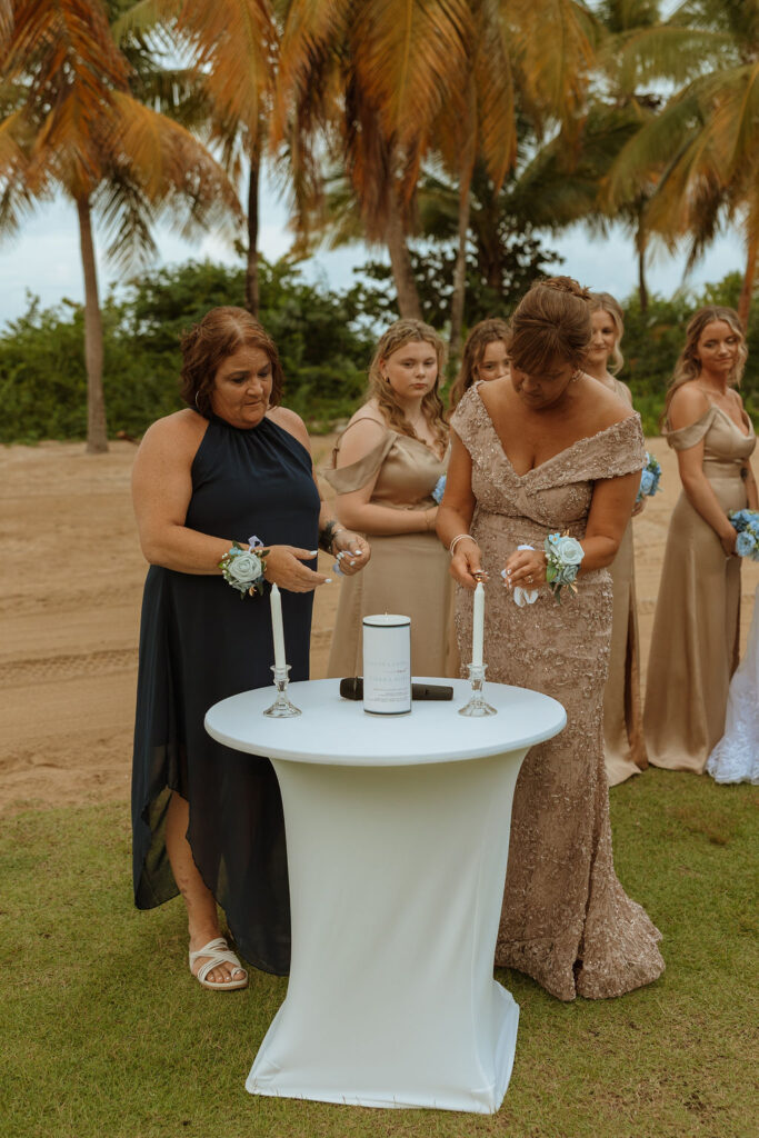 mothers of the bride and groom lighting the unity candle during a puerto rico wedding ceremony