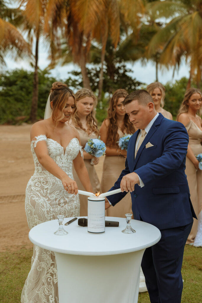 bride and groom lighting a unity candle 