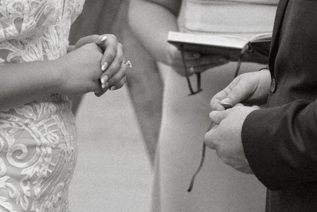 black and white closeup of ring ceremony during a puerto rico wedding 