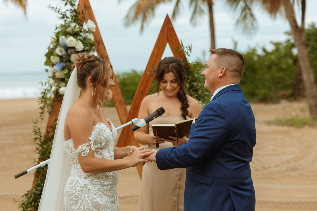 puerto rico wedding ceremony of bride putting grooms ring on his finger