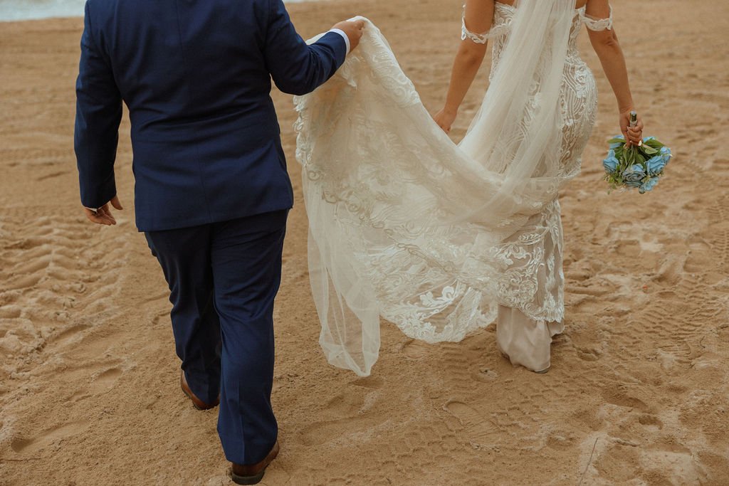 couple walking along the beach 