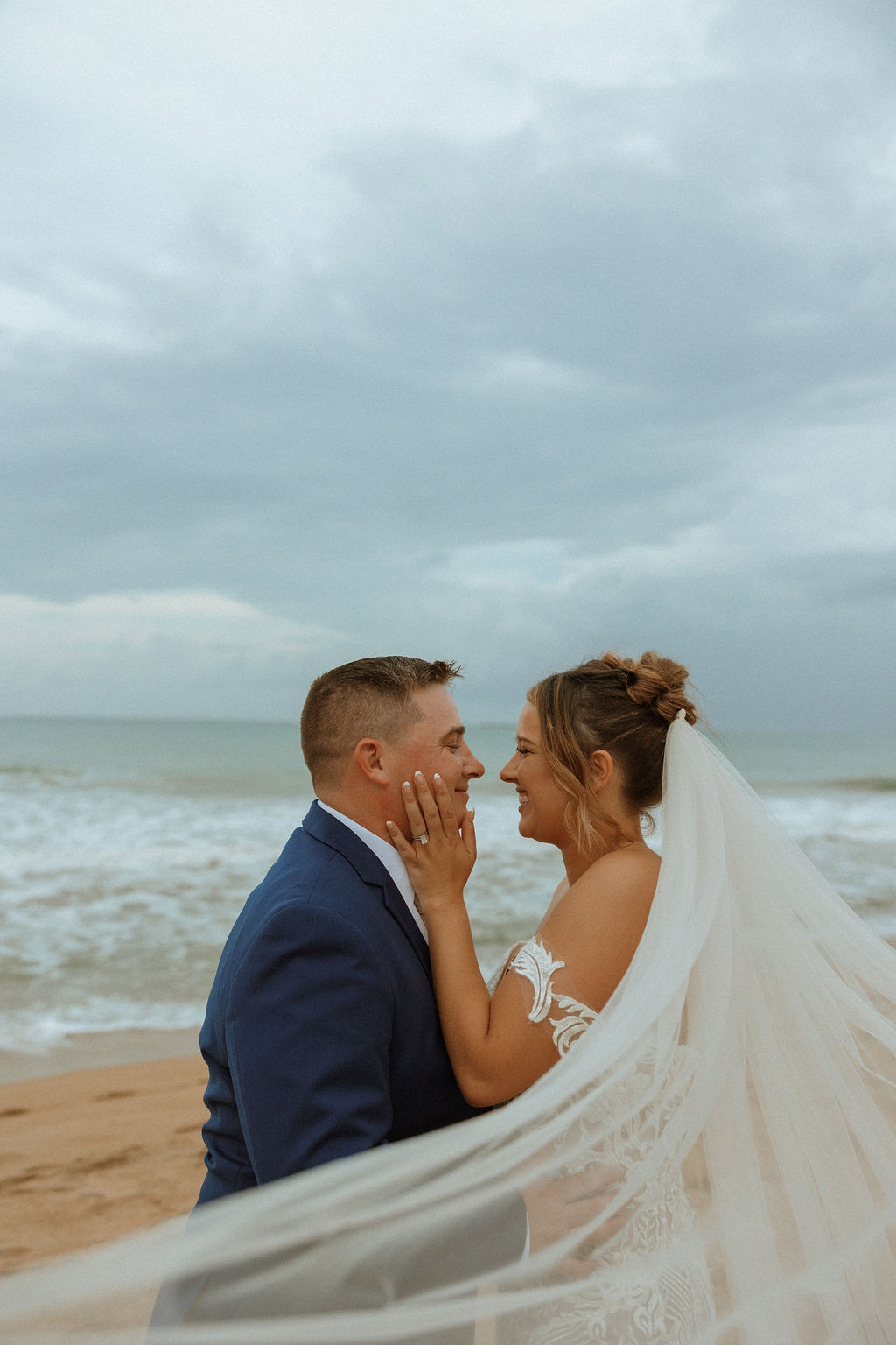 husband and wife on the beach in puerto rico