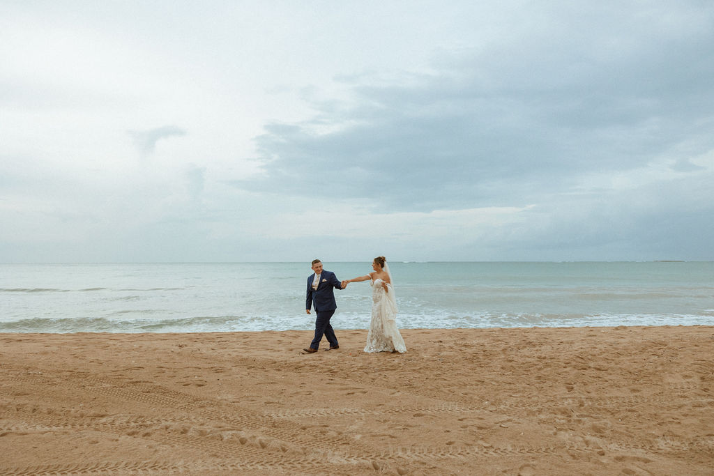 man walking with woman along the beach in puerto rico 