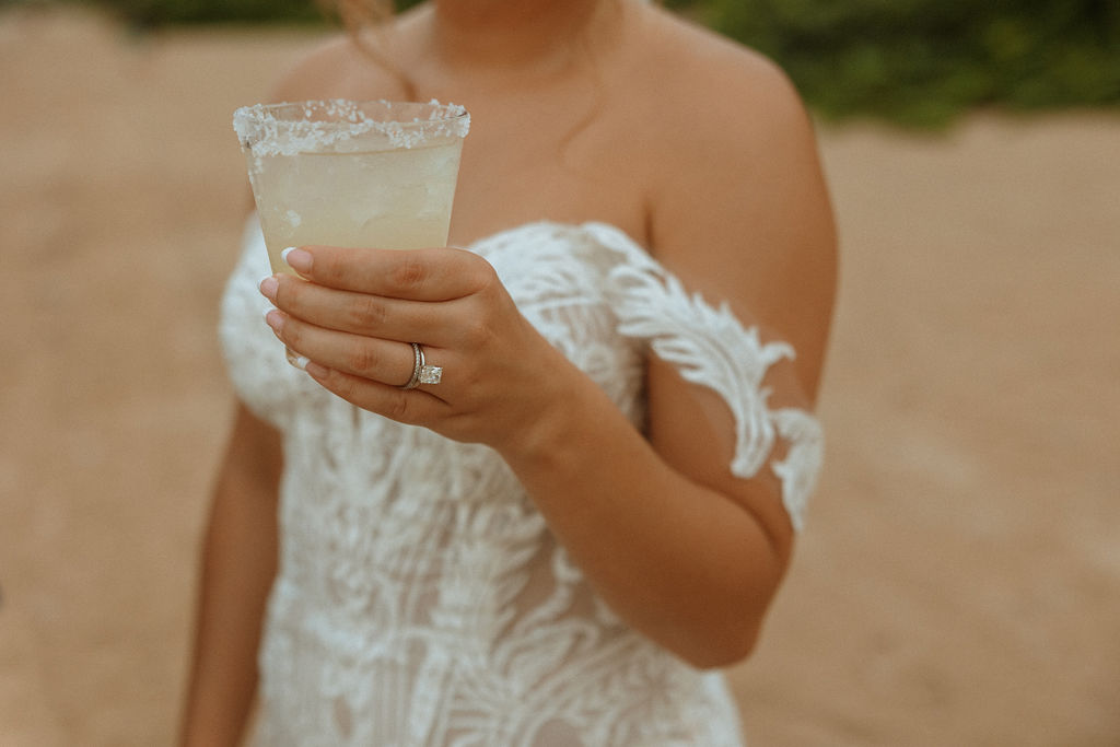 closeup of bride holding a drink