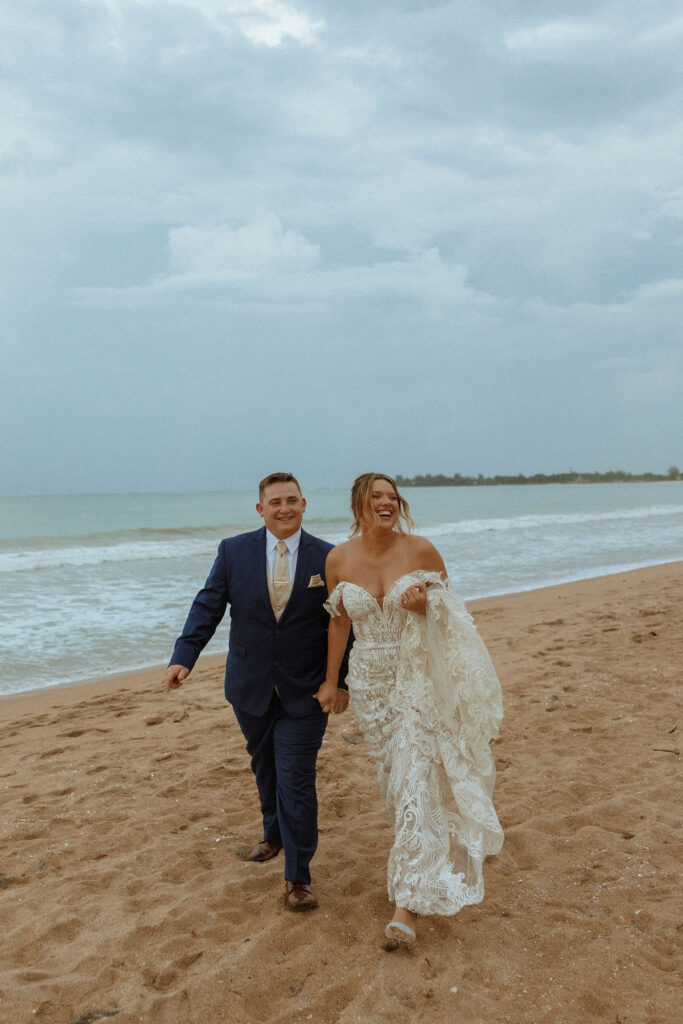 couple walking and laughing on puerto rico beach