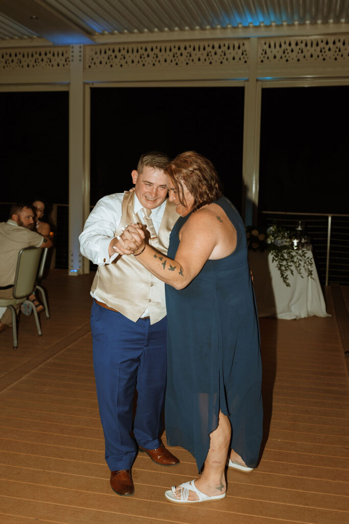 groom dancing with his mom during his wedding reception