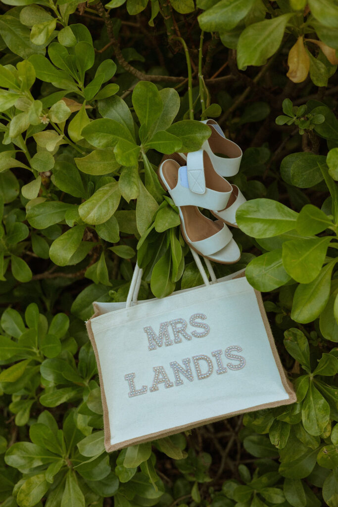 brides bag hanging on a bush in puerto rico 
