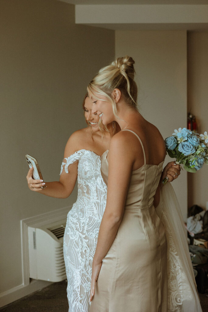 bride and bridesmaid taking a selfie