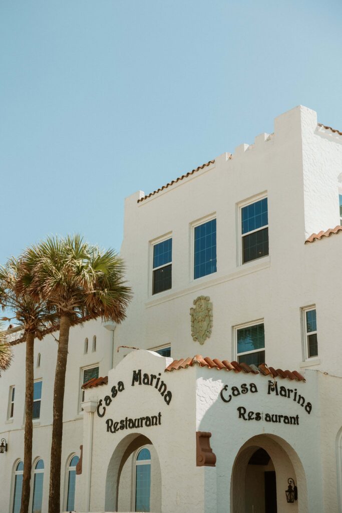 The entrance to Casa Marina with palm trees, a top place to elope in Florida