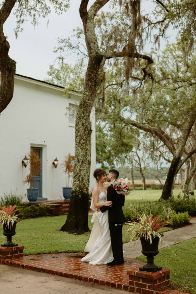 bride and groom hugging outside of their elopement Airbnb 