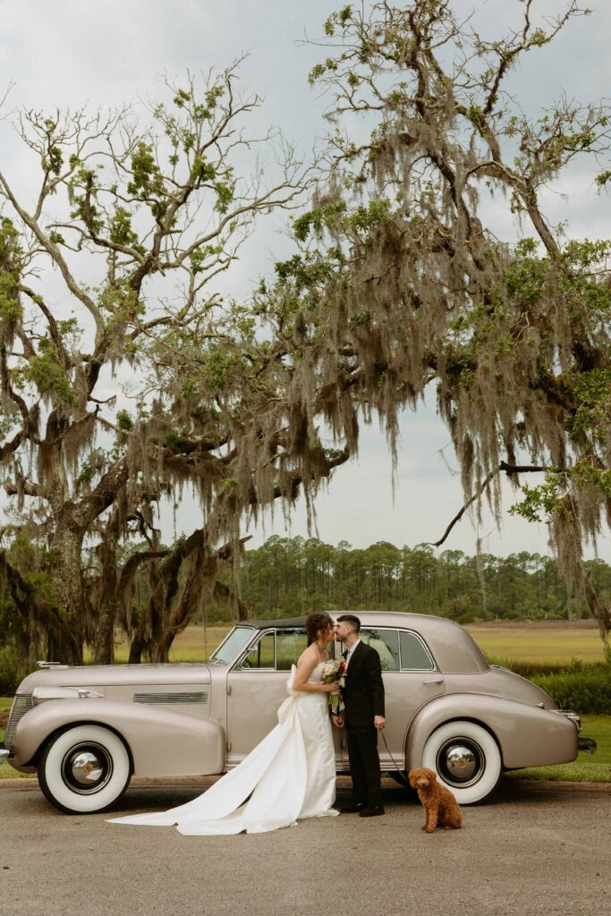 bride and groom elope in front of a vintage car in Florida