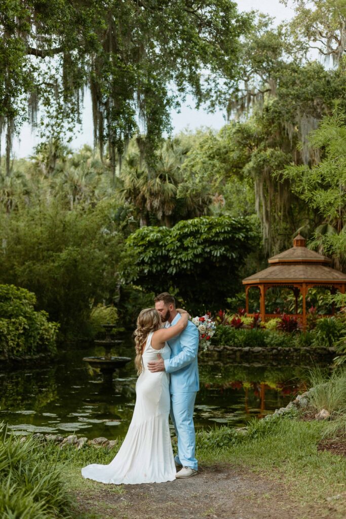 bride and groom embracing to elope at Washington Oaks Gardens in Florida