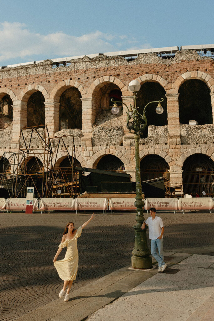 Girl twirling outside of the Verona arena in Italy