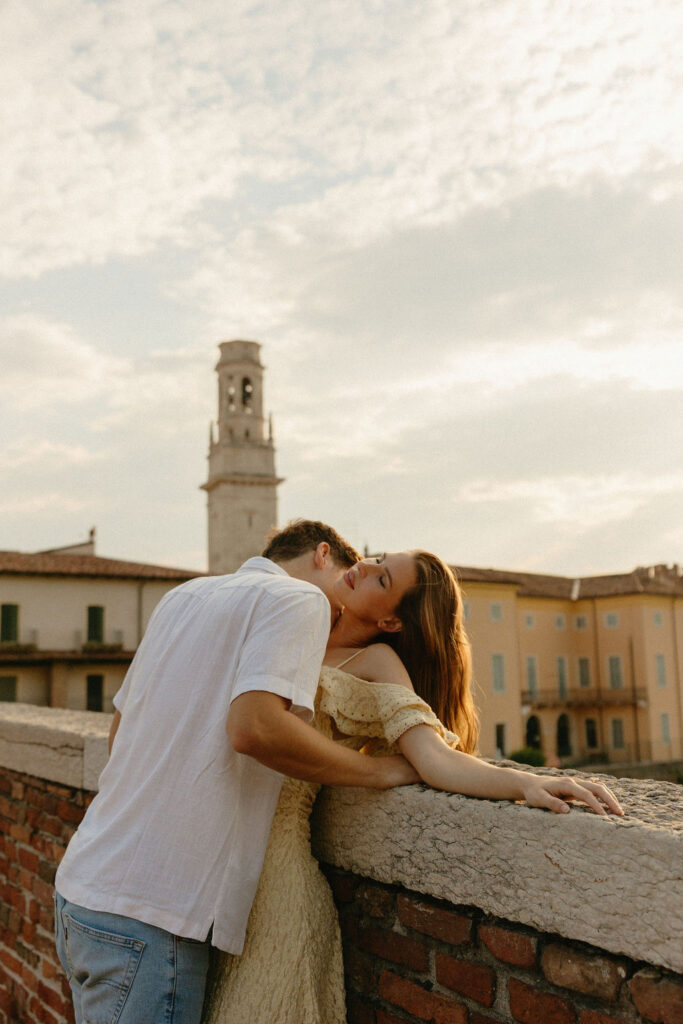 Romantic embrace on a bridge in Verona, Italy