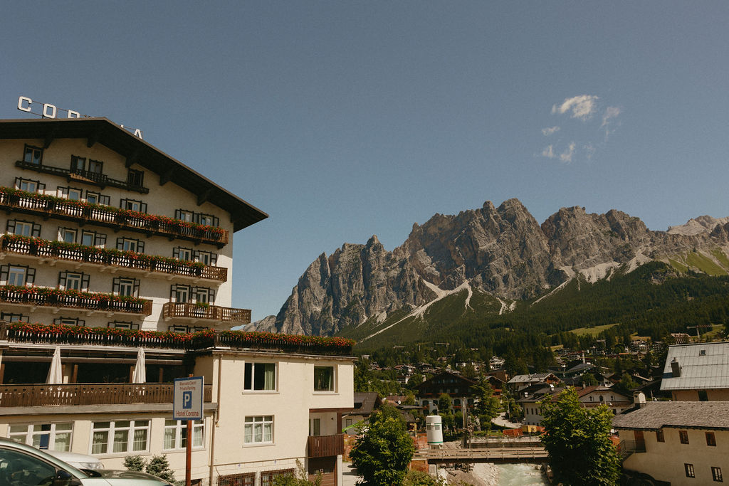 Cortina d'Ampezzo town streets with Dolomites peaks, one of the best places to visit in the Dolomites